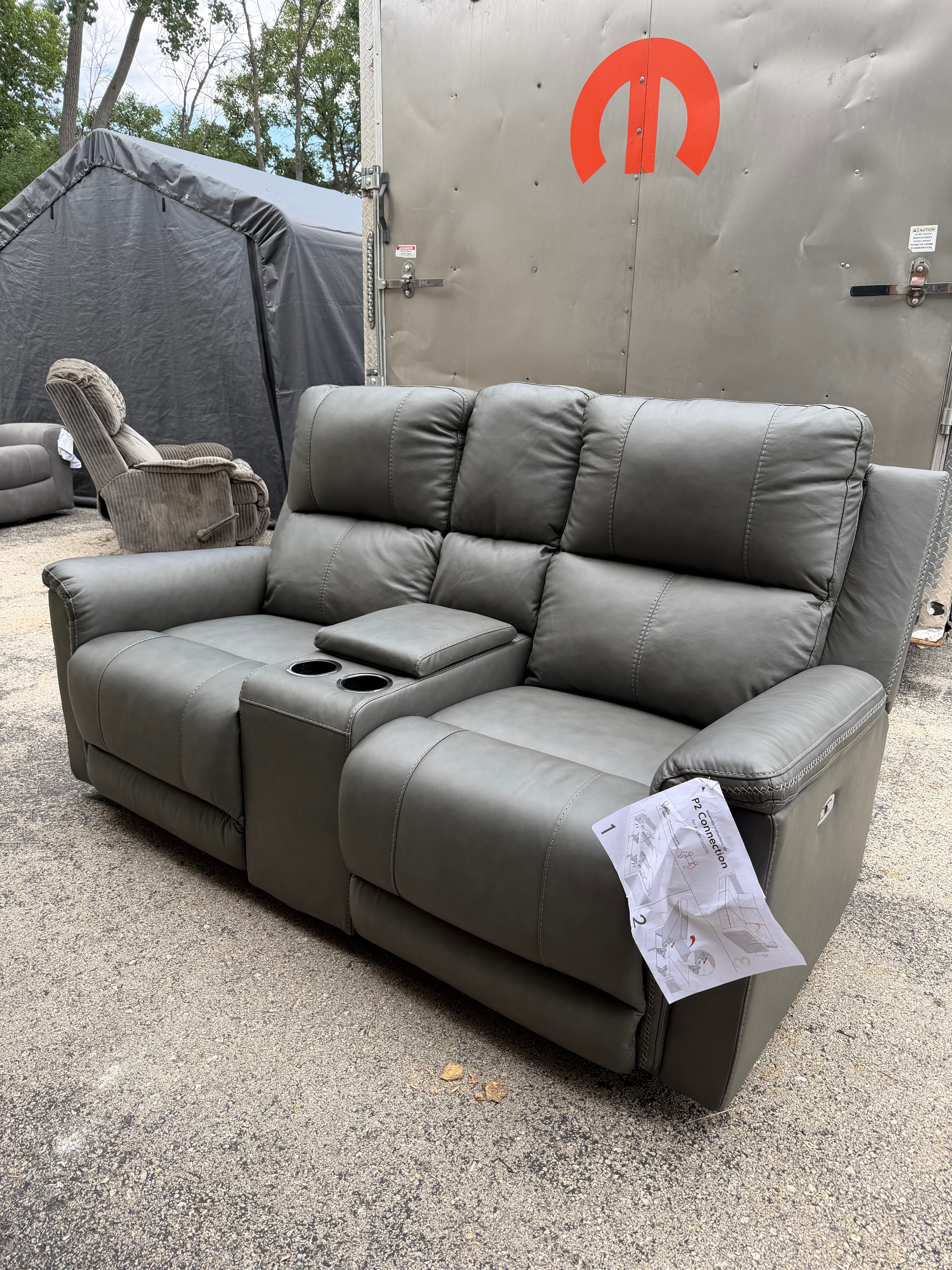 Bleckley Leather Reclining Loveseat - customer return $1800 retail.