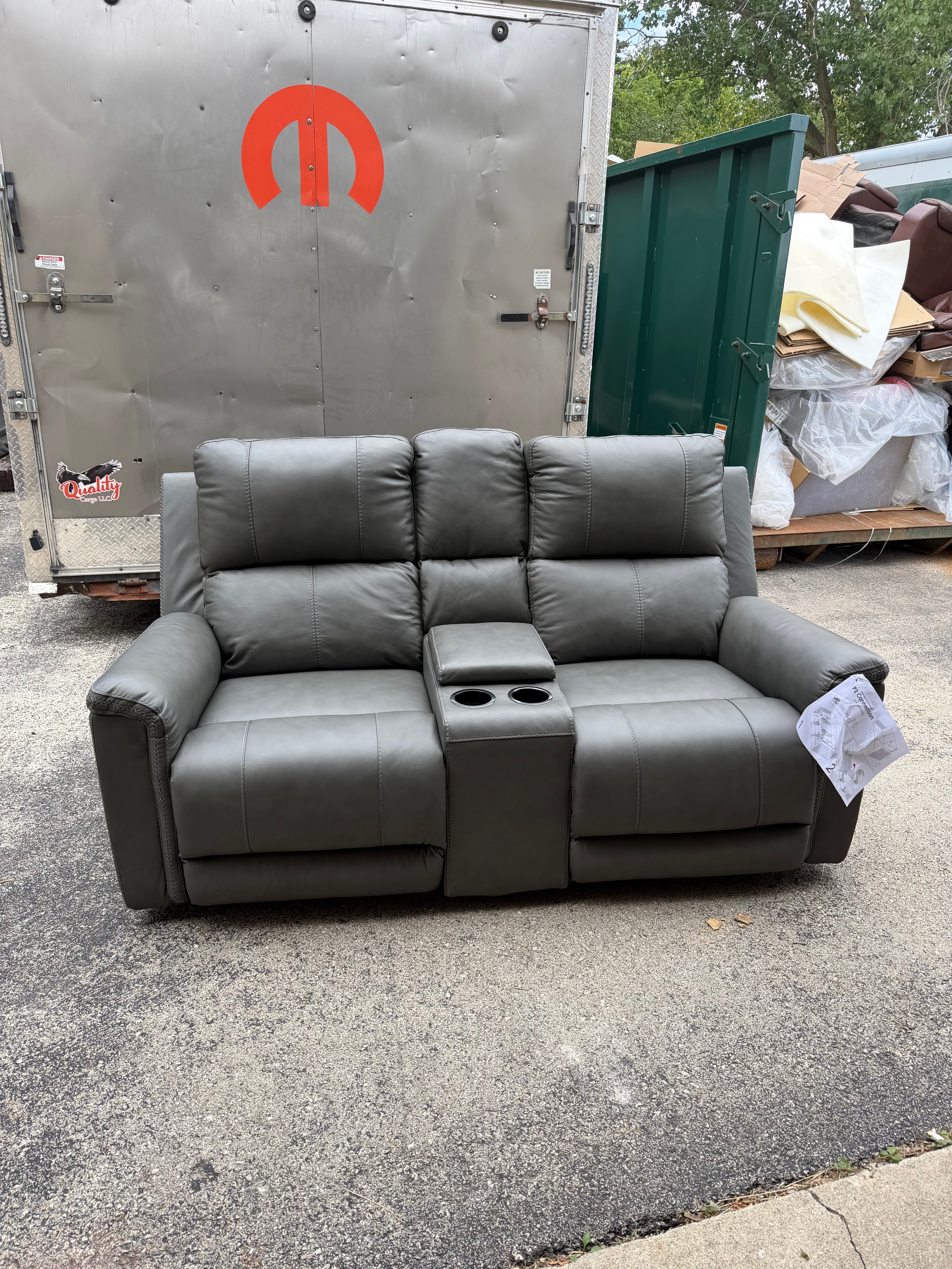Bleckley Leather Reclining Loveseat - customer return $1800 retail.