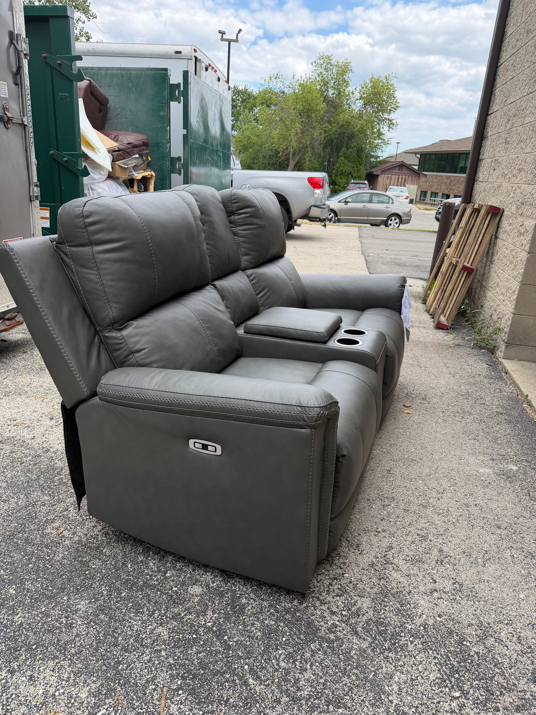 Bleckley Leather Reclining Loveseat - customer return $1800 retail.